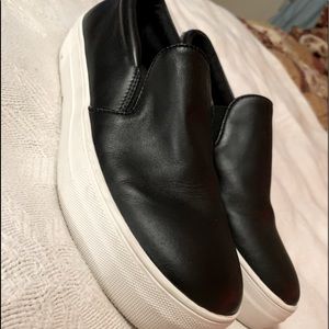 Steve Madden women’s gills black leather upper sneakers/slip ons.